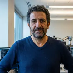 Kostas Bekris smiling in a headshot portrait